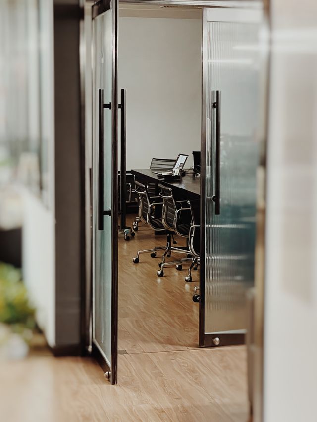 An open door leading to an office meeting room